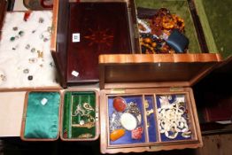 Five various wooden boxes containing costume jewellery including earrings, brooches, etc.