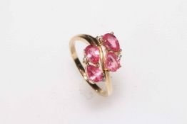 9 carat yellow gold, four pink sapphires and diamond crossover ring, size N.