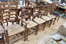 Set of six Country style rush seated ladder back dining chairs including pair carvers.
