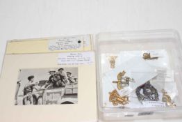 Assorted WWII cap badges and pictures of Churchill.