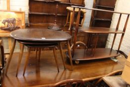 Ercol two tier book trolley and nest of three pebble tables.