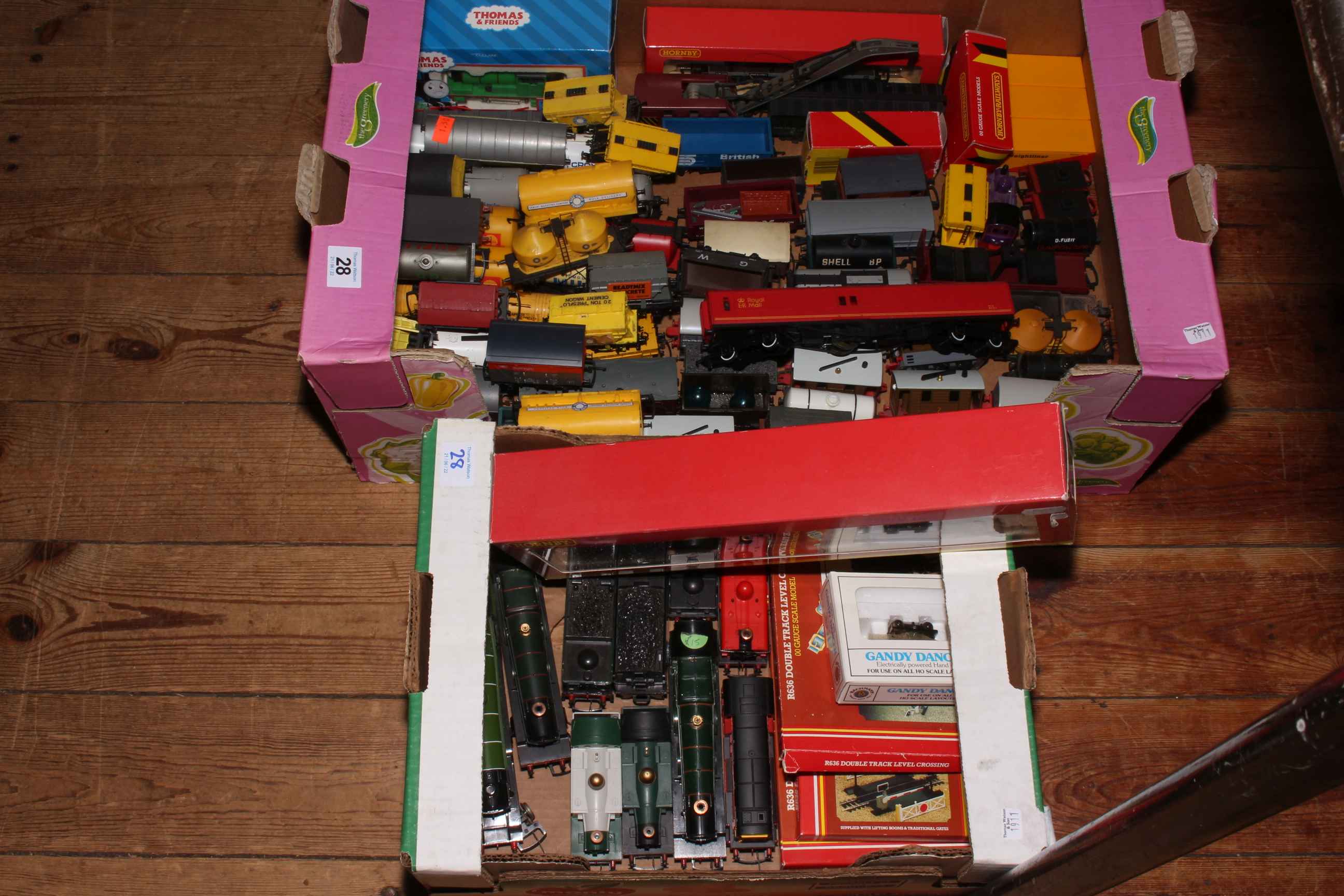 Two boxes of model railway engines and tenders, rolling stock and accessories.