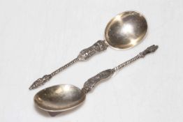Pair of white metal apostle spoons.