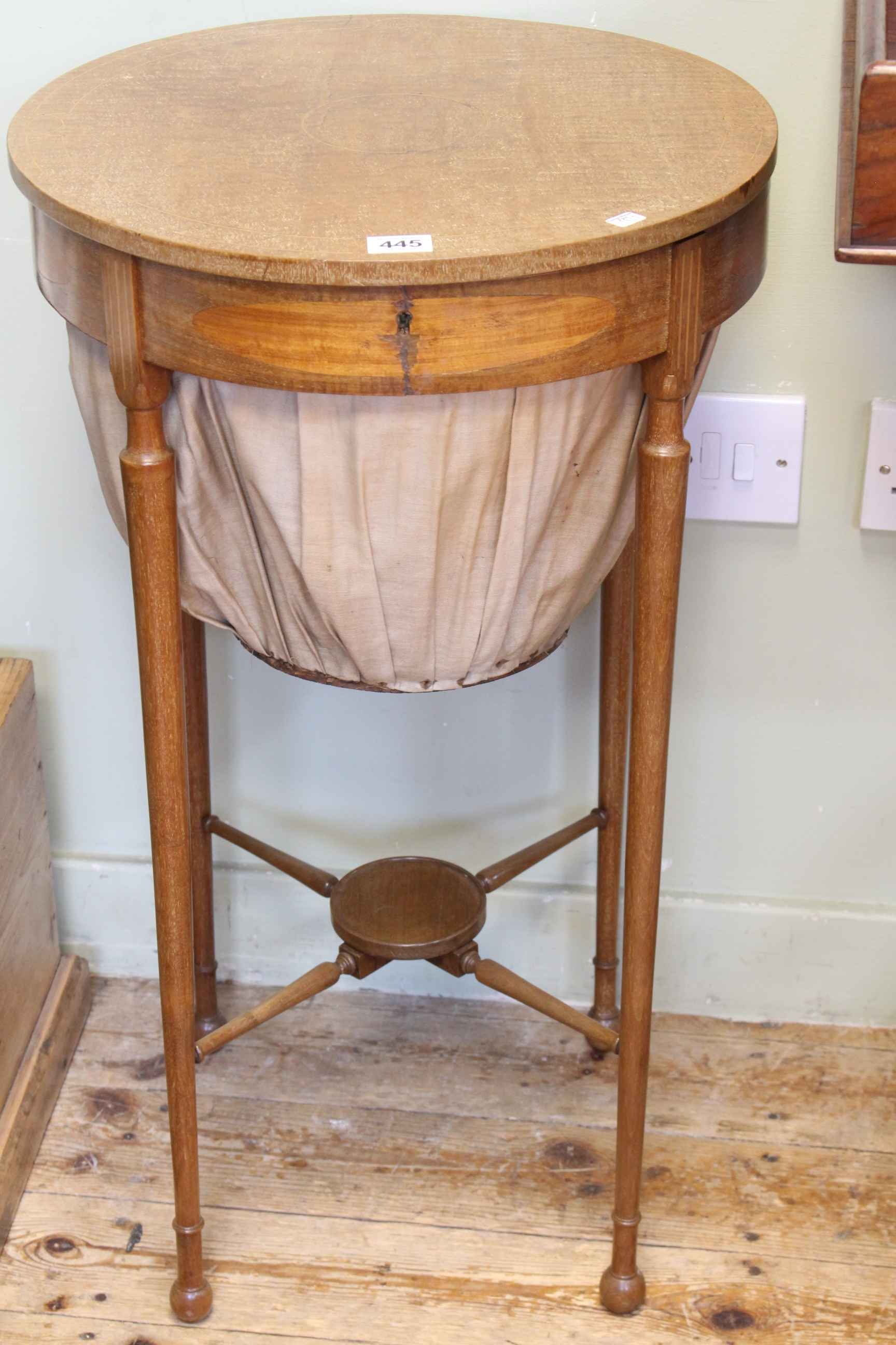 Edwardian mahogany and line inlaid circular sewing box, 72cm by 42cm diameter.