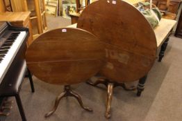 Two antique circular snap top occasional tables.