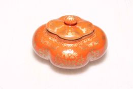 Chinese red glazed ink box with gilt decoration, Qianlong mark to base, 5cm high.