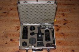 Canon AE-1 camera, five lenses, flash gun and accessories in aluminium flight case.