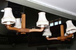 Pair of Alan 'Acornman' Grainger three branch ceiling lights and shades.