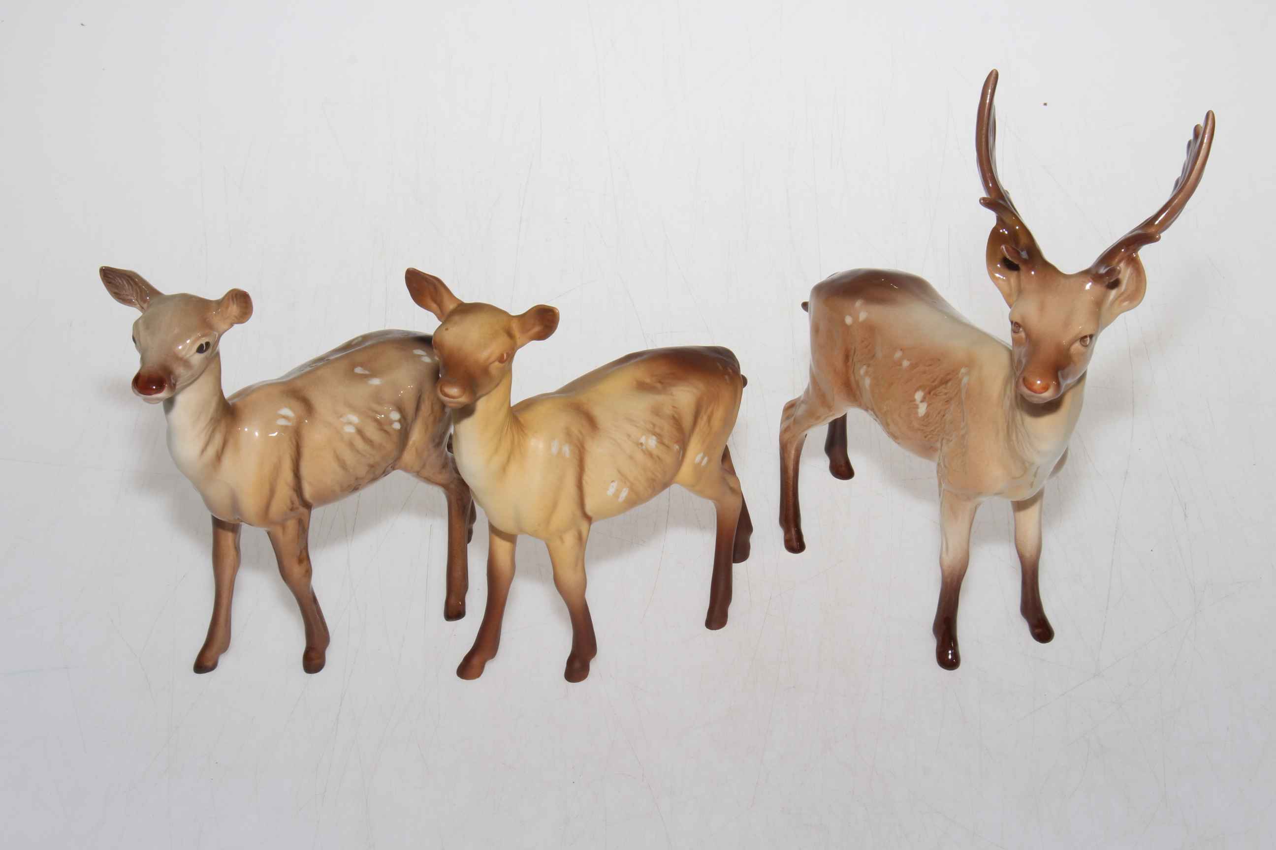 Beswick Stag and two Doe figurines.