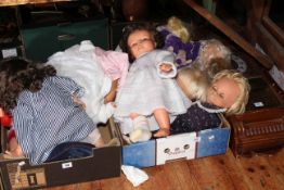 Two boxes of dolls and wall clock.