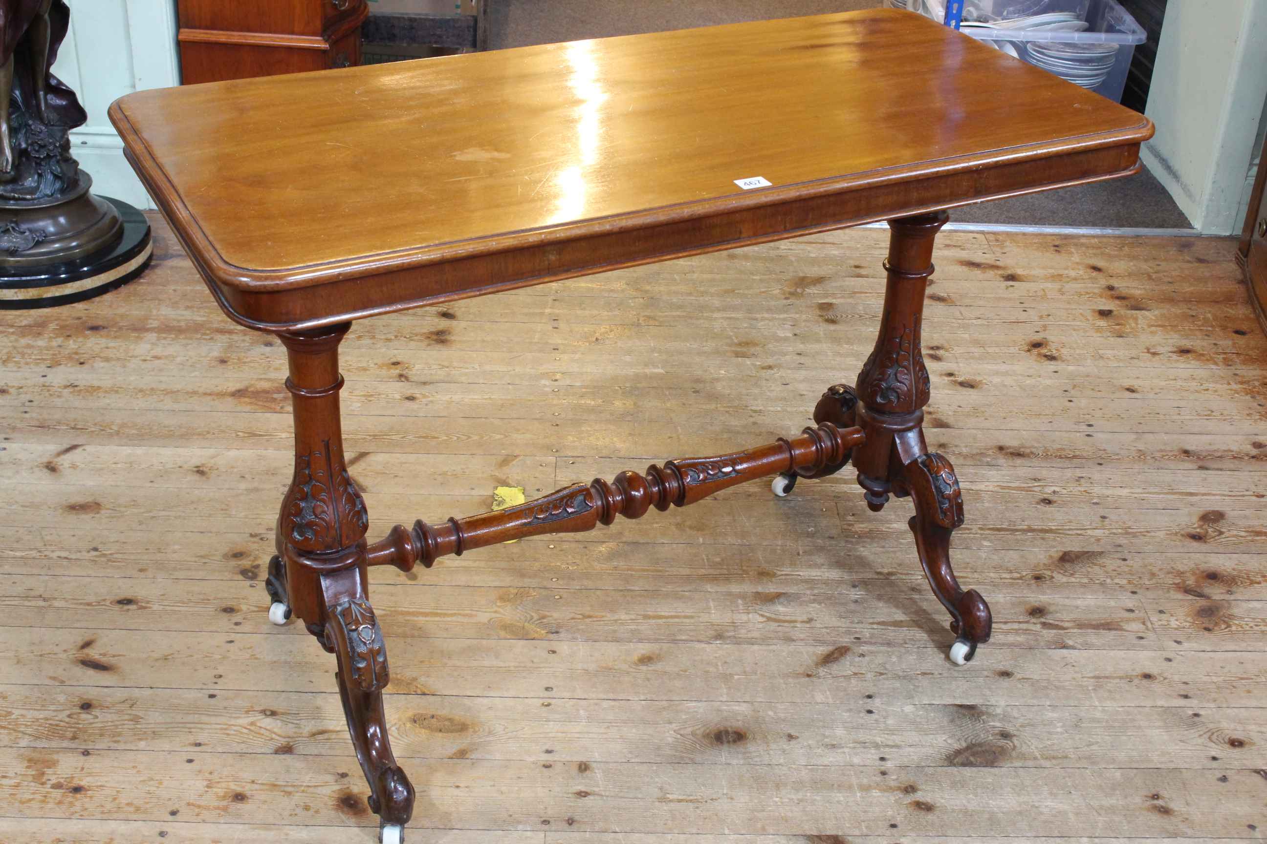 Victorian mahogany rectangular side table on carved turned pillars to four scrolled legs joined by