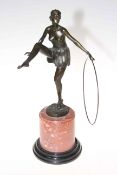 Bronze figure of semi-clad female dancer, 49cm high.