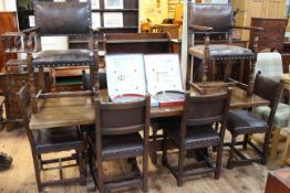 Oak refectory dining table and eight studded hide dining chairs including pair carvers (table 75cm
