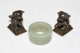 Jade Archers ring and two small bronze dog weights.