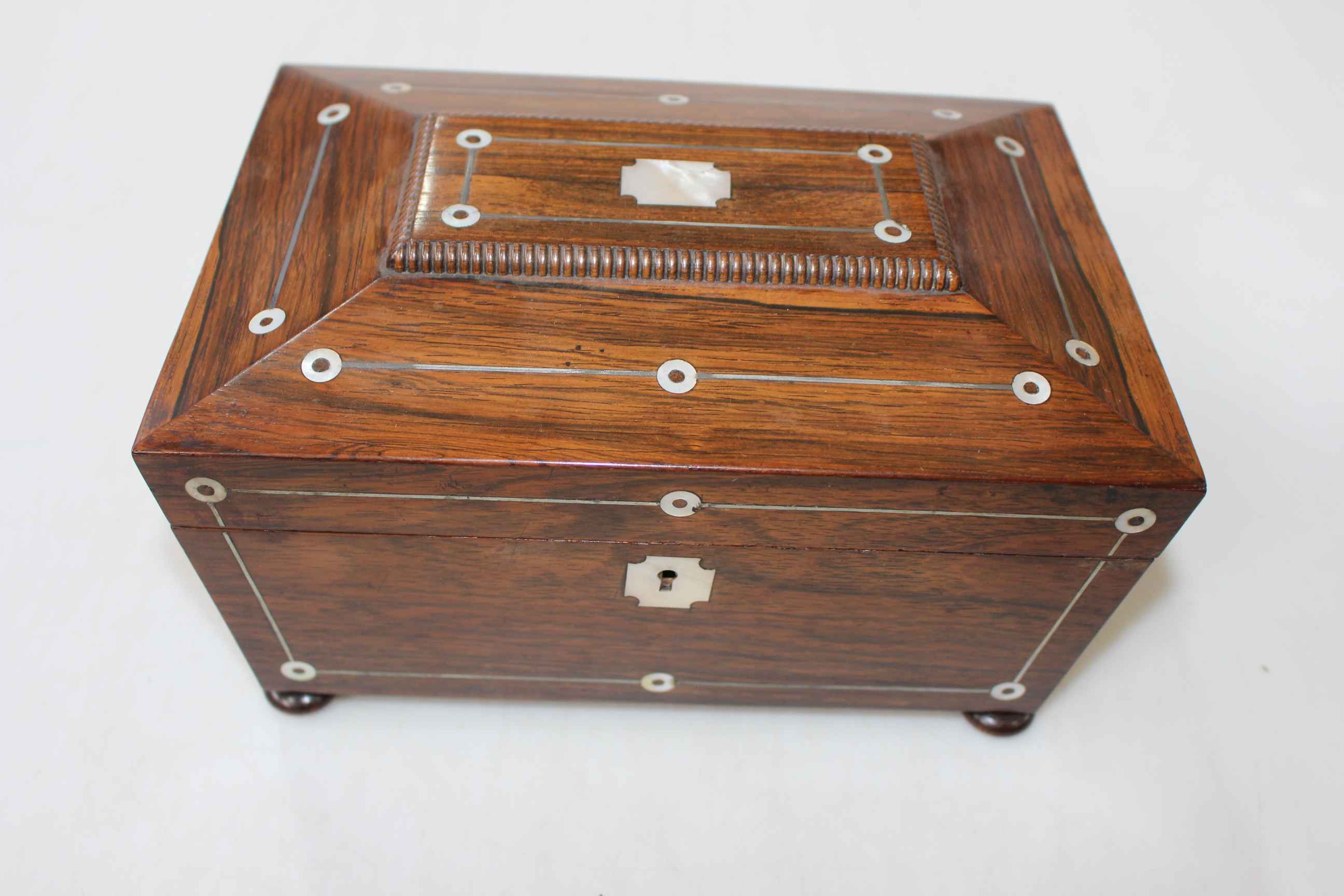 Early 19th Century rosewood sewing box with mother of pearl inlay, 25.5cm wide.