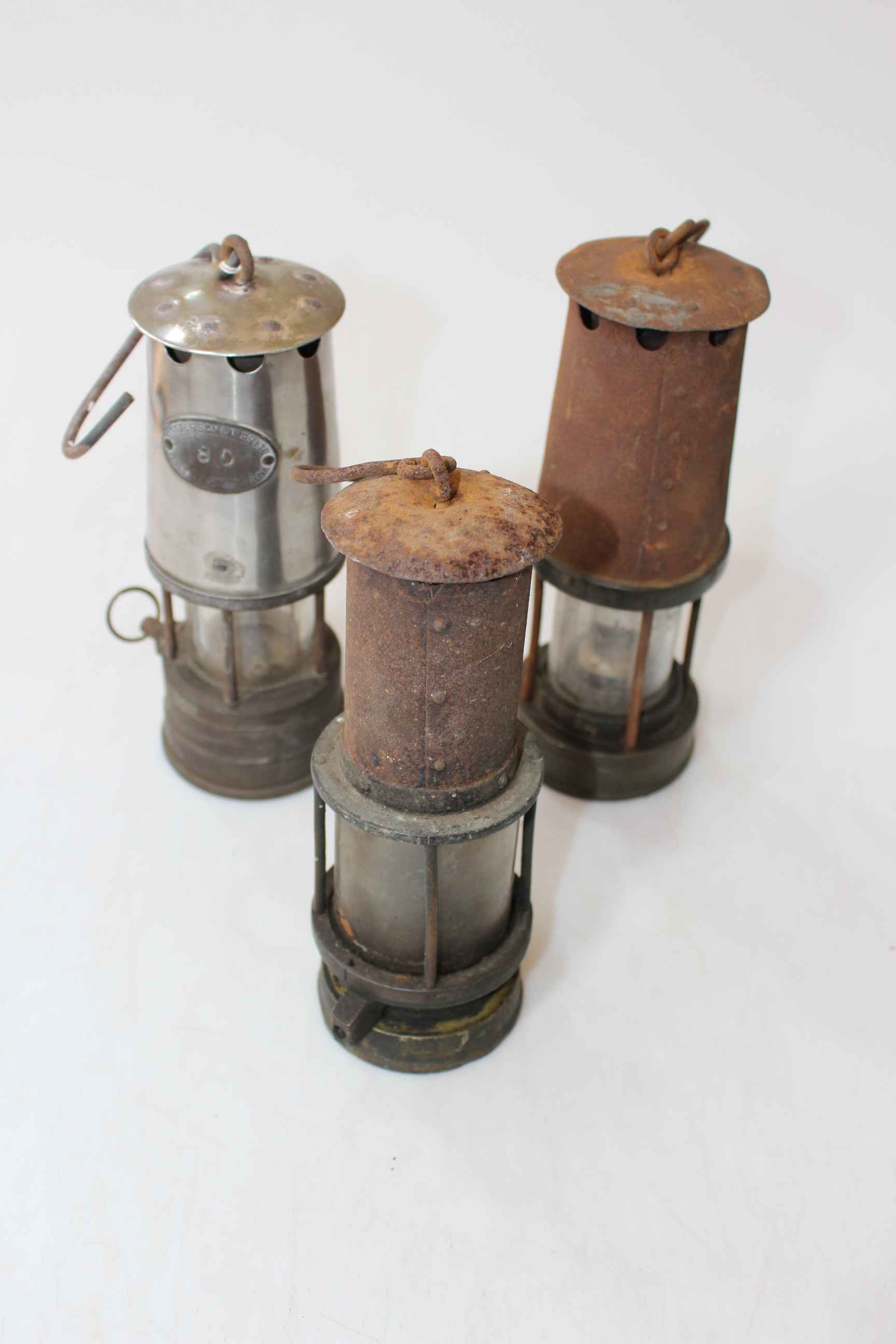 Three miners lamps including two Patterson.
