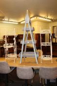 Three tier graduated rack and pair wrought metal three tier plant stands (3).