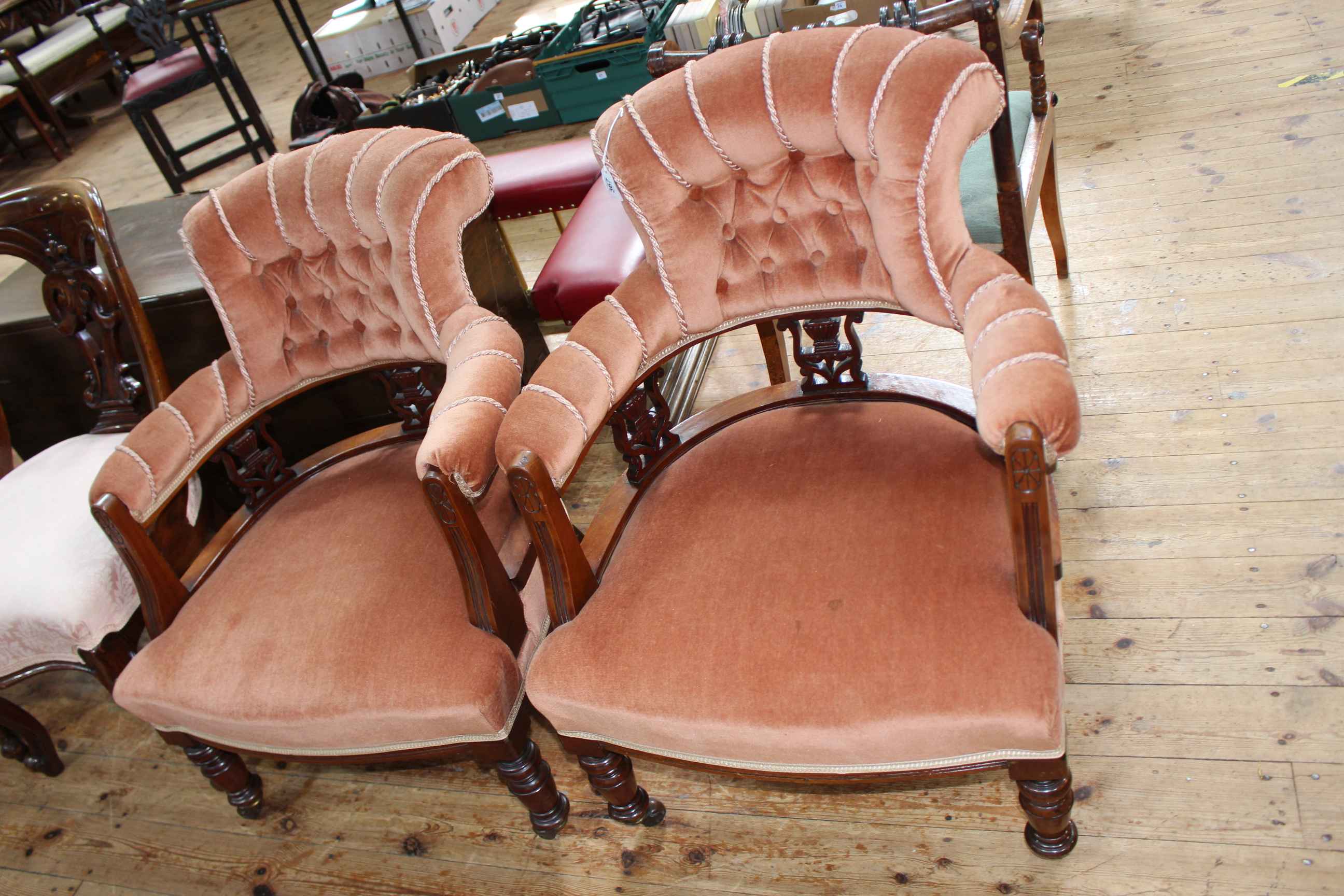Pair Victorian walnut tub chairs on turned legs in buttoned draylon.