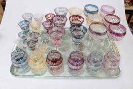 Suite of coloured crystal glasses and six hock glasses.