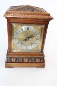 Late 19th Century carved mantel clock with striking movement, 35cm high.