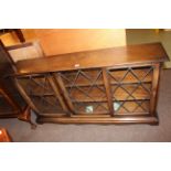 Oak leaded glazed three door bookcase and oak entertainment stand (2).