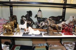 Collection of equestrian sculptures including steeple chasers and hunting piece,