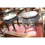 Two similar Chinese padouk and marble inset jardiniere stands (largest 49cm by 39cm diameter).