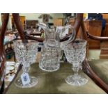 Large heavy cut glass jug with pair of goblets.