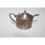 George III silver oval mustard pot by John Emes, London 1800, having bright cut decoration,