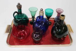 Three antique blue and green glass bottle decanters, coloured glass goblets, etc.