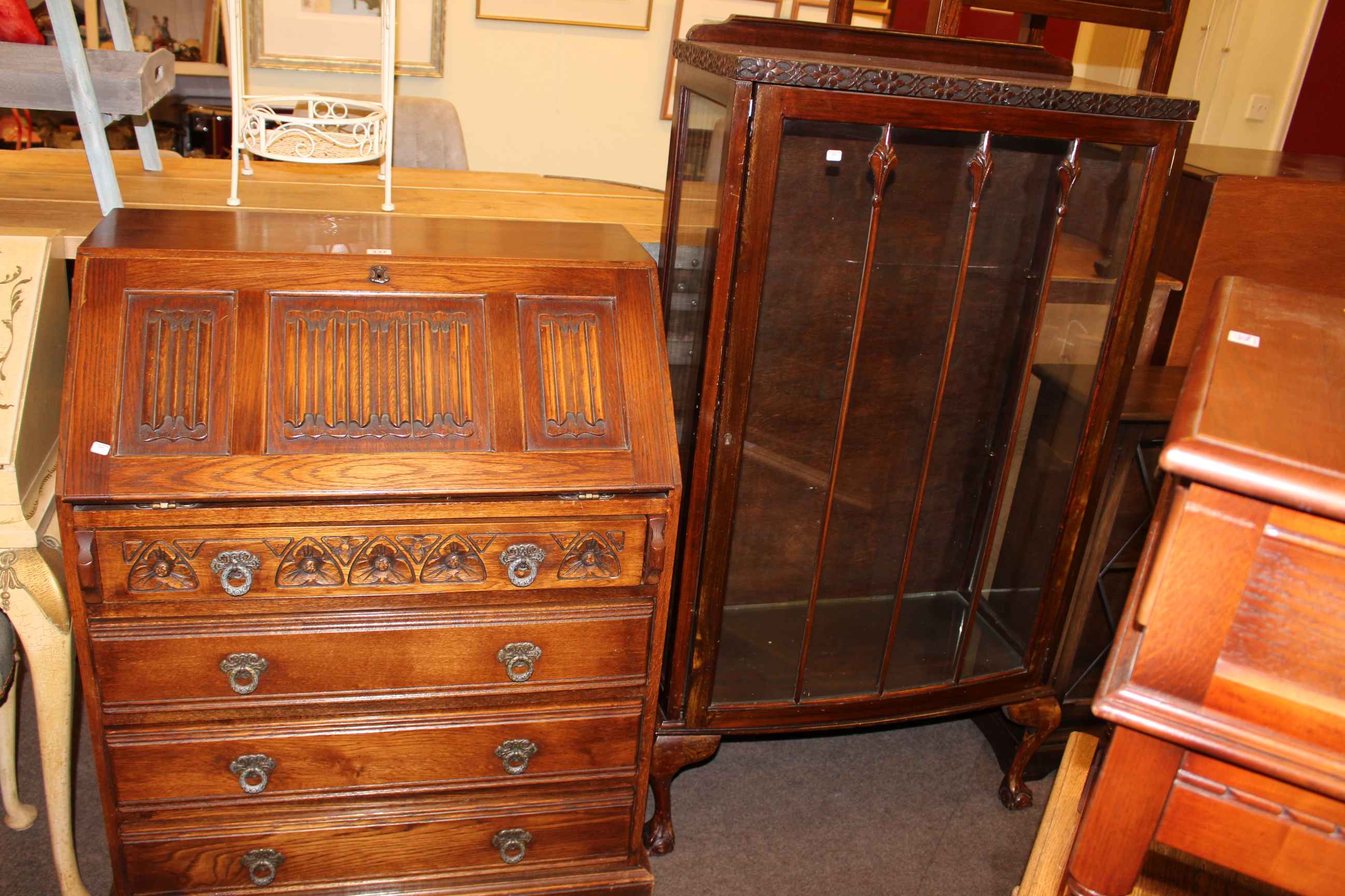Old Charm oak bureau and mahogany single door china cabinet on ball and claw legs (2).