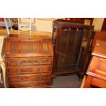 Old Charm oak bureau and mahogany single door china cabinet on ball and claw legs (2).