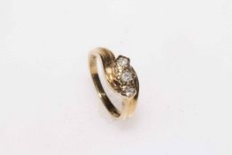 9 carat gold three stone brilliant cut diamond ring, size I.