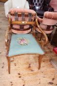 Victorian satinwood and ebonised scroll arm elbow chair.