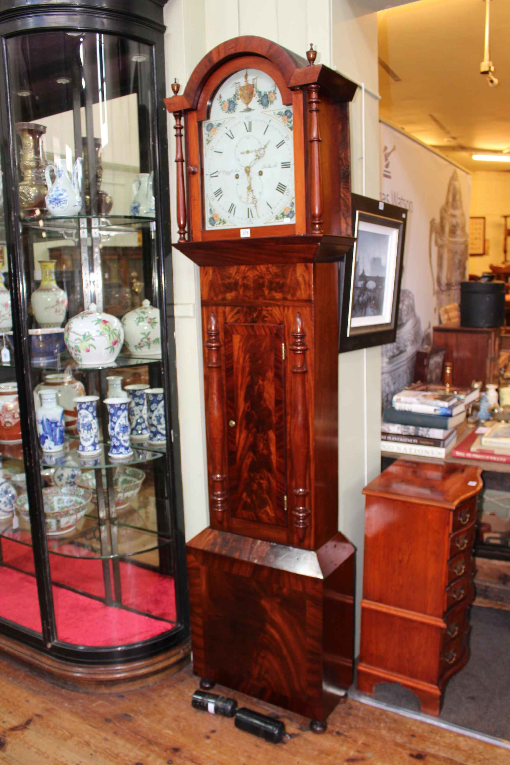 Early 19th Century mahogany eight day longcase clock having painted arched dial, signed T.