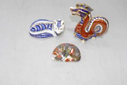 Three Royal Crown Derby paperweights, Catnap Kitten, Dragon and Fox.