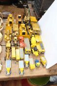 Collection of NZG, Conrad and other excavating commercial model vehicles including Blue Circle