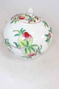 Chinese peach decorated jar and cover, 21cm.
