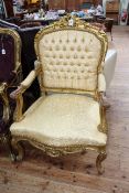 Pair gilt framed open armchairs in light gold fabric.