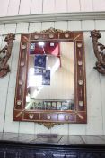 Continental wall mirror, the brass mounted frame with applied roundels, 100cm by 64cm.