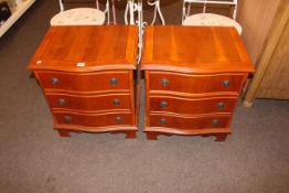 Pair yew serpentine front three drawer pedestal chests, 58cm by 51cm by 39cm.