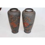 Pair Japanese vases with flat relief blossom and butterfly decoration, blue character marks, 23.5cm.