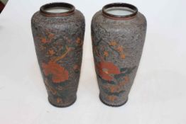 Pair Japanese vases with flat relief blossom and butterfly decoration, blue character marks, 23.5cm.