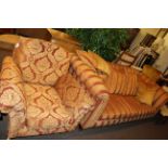 Three seater settee and chair in striped and foliate pattern fabric.