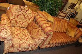 Three seater settee and chair in striped and foliate pattern fabric.