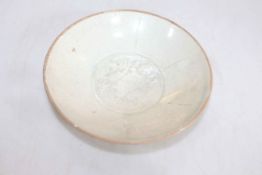 Chinese saucer dish with centre fish decoration, 17cm diameter.