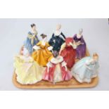 Collection of eight Royal Doulton lady figures.