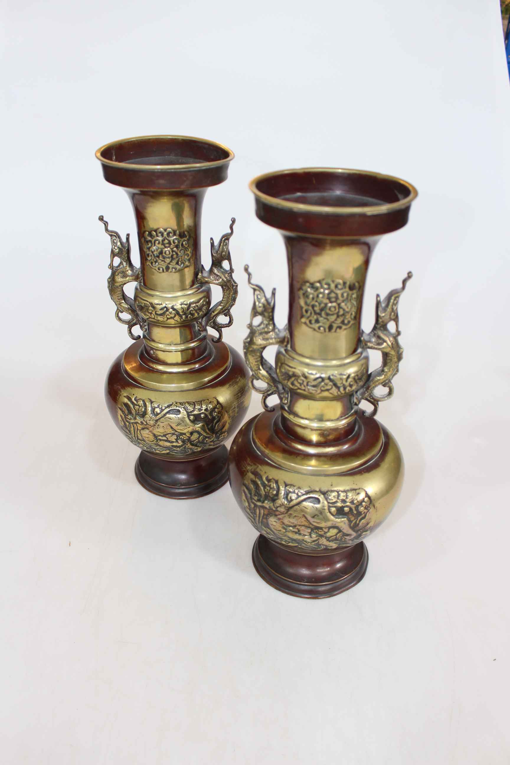 Pair large Oriental metal vases with creature handles and relief decoration, 35cm.
