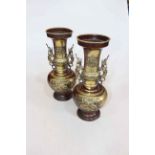 Pair large Oriental metal vases with creature handles and relief decoration, 35cm.