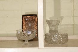 Two crystal glass bowls and two vases.